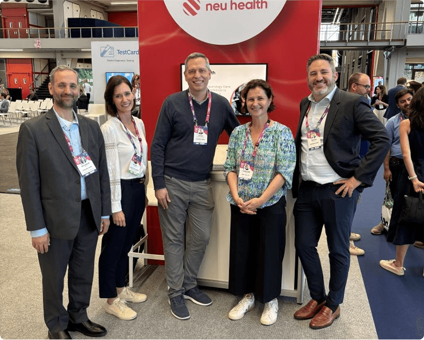 Neu Health team posing at their conference booth